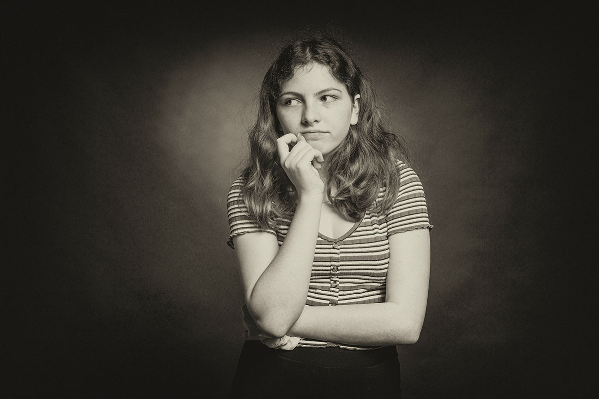 Young woman reflecting on the potential physical effects of abortion.